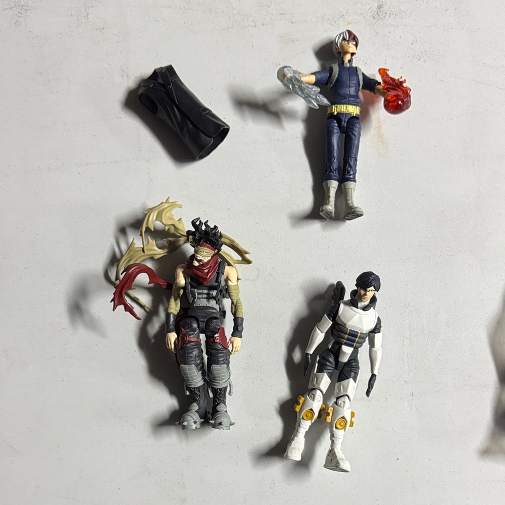 Heroic Action Figure Trio with Red, Blue, and Black Accents